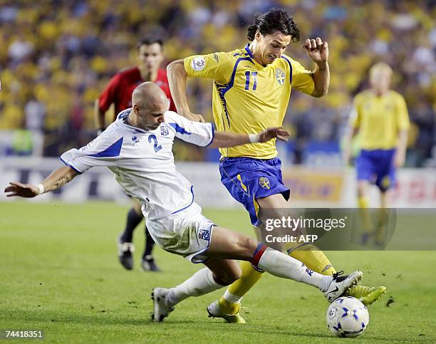 Sweden's Zlatan Ibrahimovic and Iceland's Gretar Steinsson chase the ball during their Euro2008 Group F qualifying football match at Solna's Rasunda...