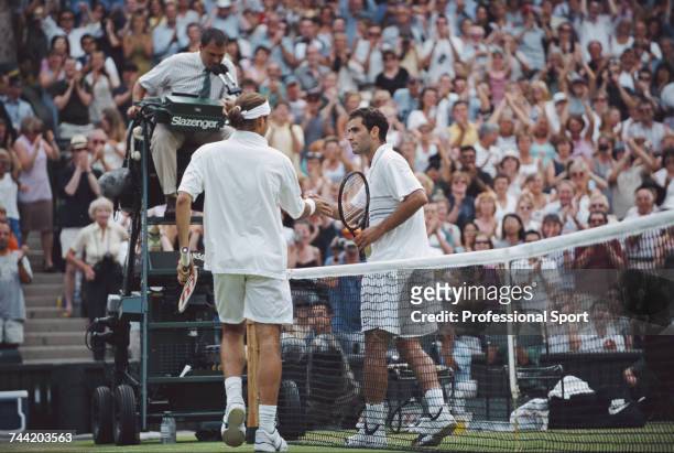 Swiss tennis player Roger Federer pictured shaking hands with American tennis player Pete Sampras after winning the match 7-6, 5-7, 6-4, 6-7, 7-5 in...