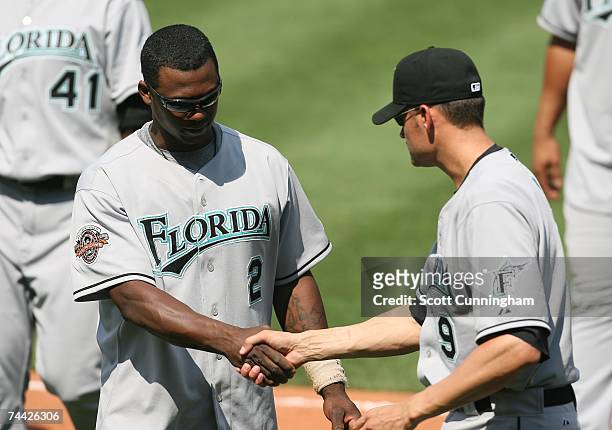 Hanley Ramirez of the Florida Marlins is congratulated by Andy Fox after the game against the Atlanta Braves at Turner Field on June 6, 2007 in...
