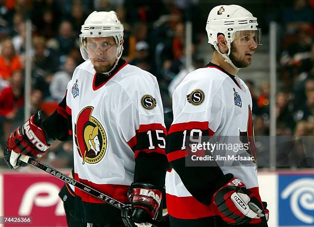 Dany Heatley and teammate Jason Spezza of the Ottawa Senators react to a play during Game Five of the 2007 Stanley Cup finals against the Anaheim...