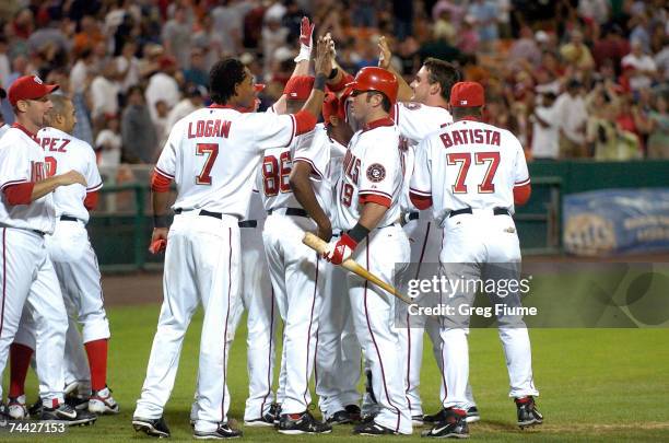 The Washington Nationals celebrate beating the Pittsburgh Pirates 6-5 on a wild pitch in the ninth inning at RFK Stadium June 6, 2007 in Washington,...