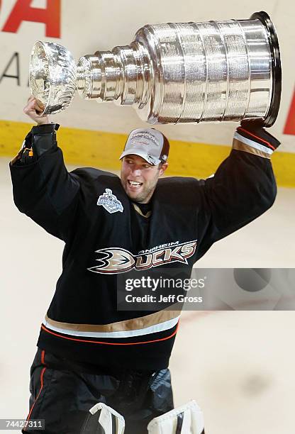 Goaltender Jean-Sebastien Giguere of the Anaheim Ducks celebrates lifting the Stanley Cup after defeating the Ottawa Senators in Game Five of the...
