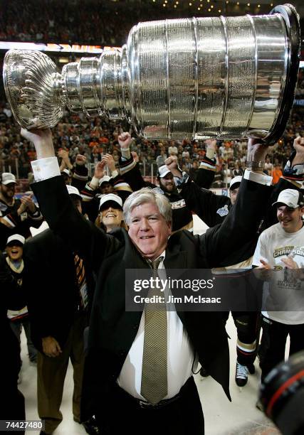 General Manager, Brian Burke of the Anaheim Ducks hoists the Stanley Cup after his team's victory over the Ottawa Senators 6-2 during Game Five of...