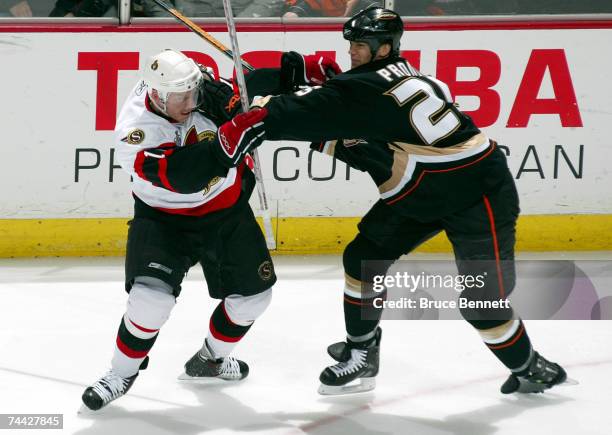 Daniel Alfredsson of the Ottawa Senators is pushed by Chris Pronger of the Anaheim Ducks during Game Five of the 2007 Stanley Cup finals on June 6,...