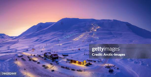 ski slopes at twilight shot from above-view of mt. hlidarfjall ski slopes, akureyri, iceland. image shot with a drone. - akureyri iceland stockfoto's en -beelden