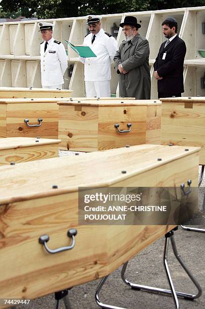 French chief rabbi Ary Samun , Muslim military chaplain Nordin Bouzid and Catholic military chaplain Bonnevie pay their respect in front of the...