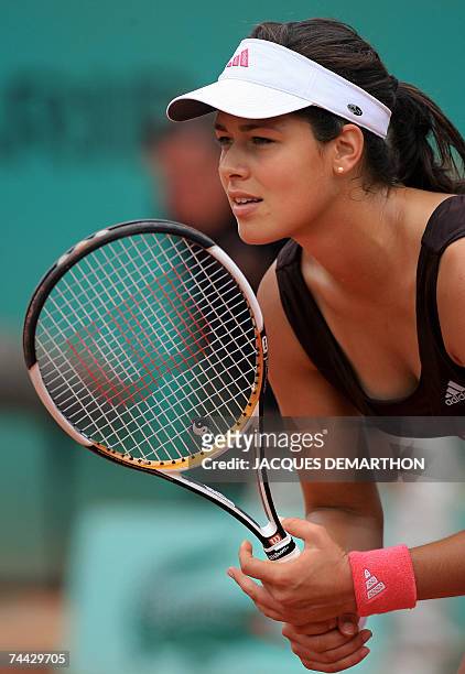 Serbian player Ana Ivanovic looks for a ball from Russian player Maria Sharapova during their French Tennis Open semi final match at Roland Garros,...