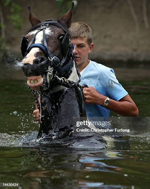 Youth washes his horse in the River Eden at the Appleby Horse Fair on June 7, 2007 in Appleby-in-Westmorland, England. Appleby Horse Fair has existed...