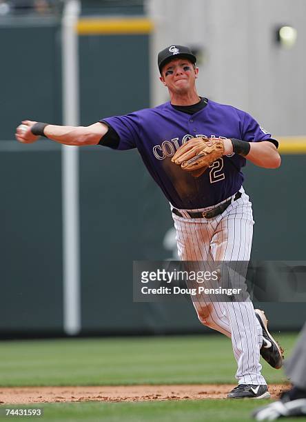 Troy Tulowitzki of the Colorado Rockies throws against the St. Louis Cardinals at Coors Field on May 28, 2007 in Denver, Colorado. The Rockies won...