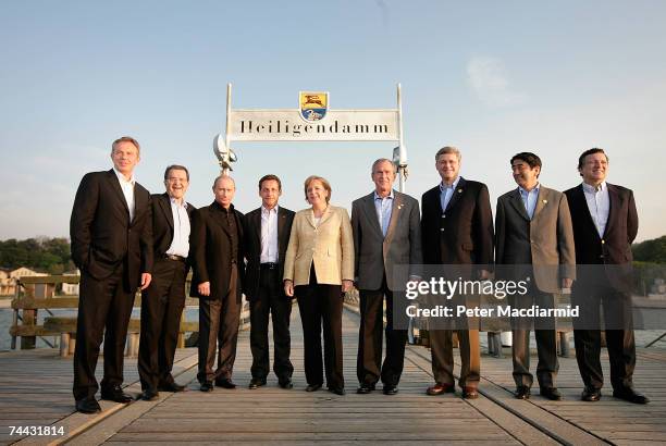 Leaders pose for a group photograph on a sea front pier British Prime Minister Tony Blair, Italian Prime Minister Romano Prodi, Russian President...