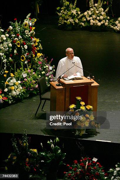 Rev. Donald Epps, of Seabreeze United Church in Daytona Beach conducts the funeral service for Bill France Jr. At Mary McLeod Bethune Performing Arts...