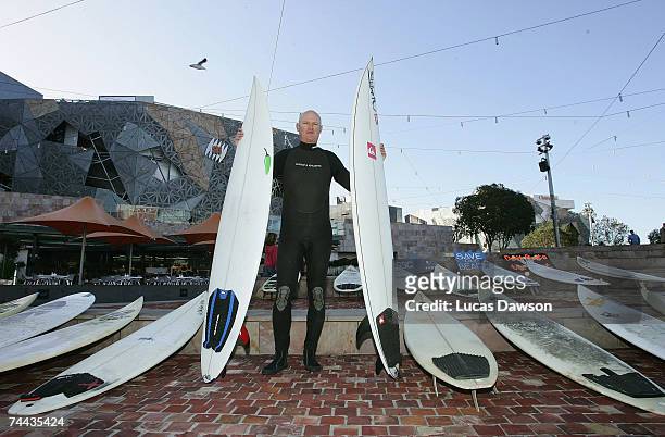 Howard Louis poses with surfboards before the Surfrider Foundation Australia march from Federation Square to Parliament House June 8, 2007 in...