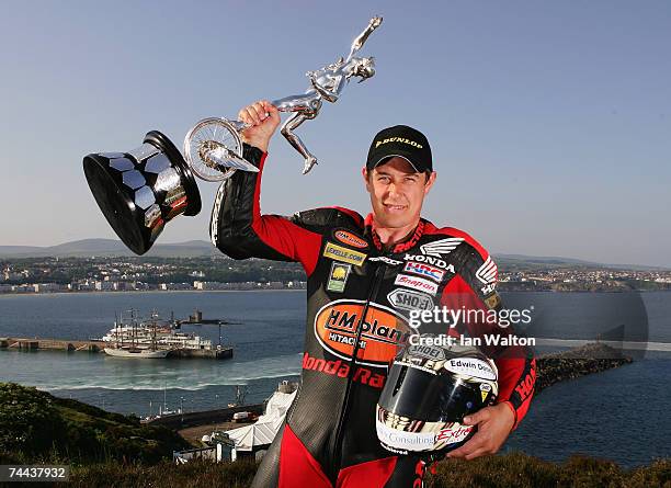 John McGuinness poses with the senior trophy during the Isle of Man TT Races on June 7, 2007 in Douglas, Isle of Man.