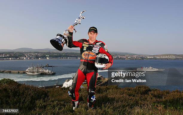 John McGuinness poses with the senior trophy during the Isle of Man TT Races on June 7, 2007 in Douglas, Isle of Man.