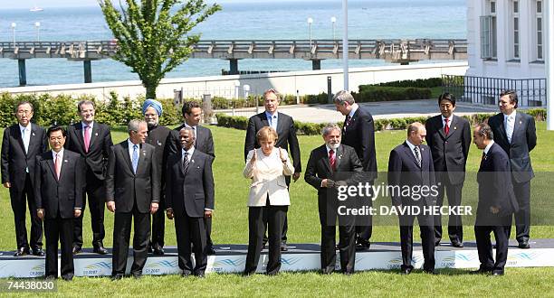 Heads of State and representatives of the top five developing nations pose for a family picture 08 June 2007 at the G8 summit in Heiligendamm,...