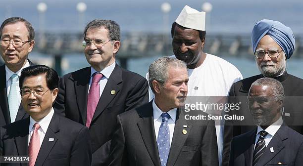 President George W. Bush stands at a group photo with Chinese President Hu Jintao and South African President Thabo Mbeki and Secretary-General of...