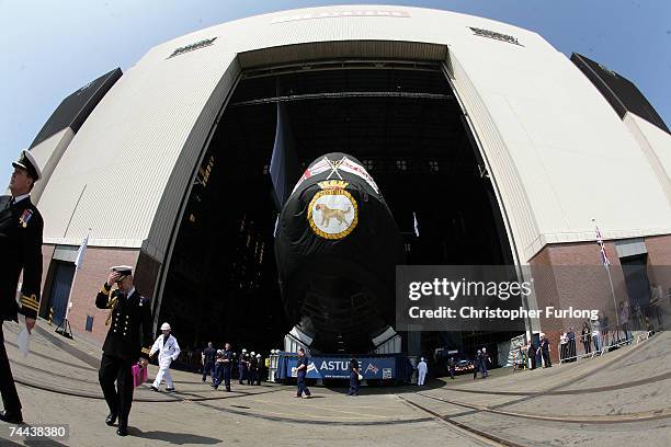 The new Royal Navy submarine HMS Astute starts to emerge from it's berth after being launched by Camilla, Duchess of Cornwall at the BAES shipyard on...