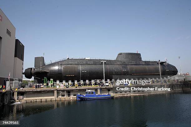 The new Royal Navy submarine HMS Astute emerges from it's berth after being launched by Camilla, Duchess of Cornwall at the BAES shipyard on June 8,...