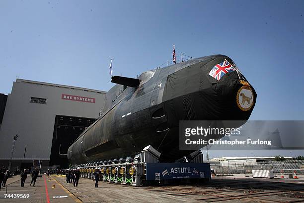 The new Royal Navy submarine HMS Astute emerges from it's berth after being launched by Camilla, Duchess of Cornwall at the BAES shipyard on June 8,...