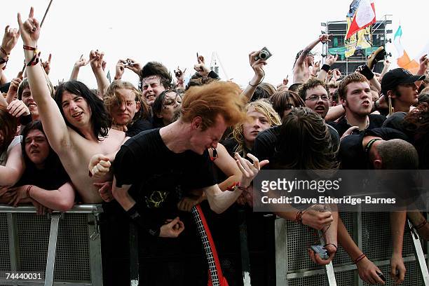 Fans in the audience enjoy Megadeth perform on the main stage during day one of the Download Festival at Donington Park on June 8, 2007 in Donington,...