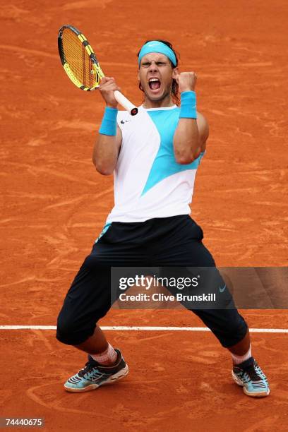 Rafael Nadal of Spain celebrates winning match point against Novak Djokovic of Serbia during the Men's Singles Semi Final on day thirteen of the...