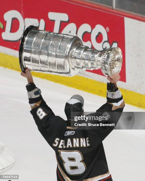 Teemu Selanne of the Anaheim Ducks hoists the Stanley Cup after his team's victory over the Ottawa Senators during Game Five on June 6, 2007 at Honda...