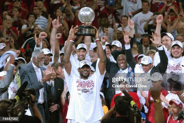LeBron James of the Cleveland Cavaliers holds the Eastern Conference Championship trophy after defeating the Detroit Pistons in Game Six of the...