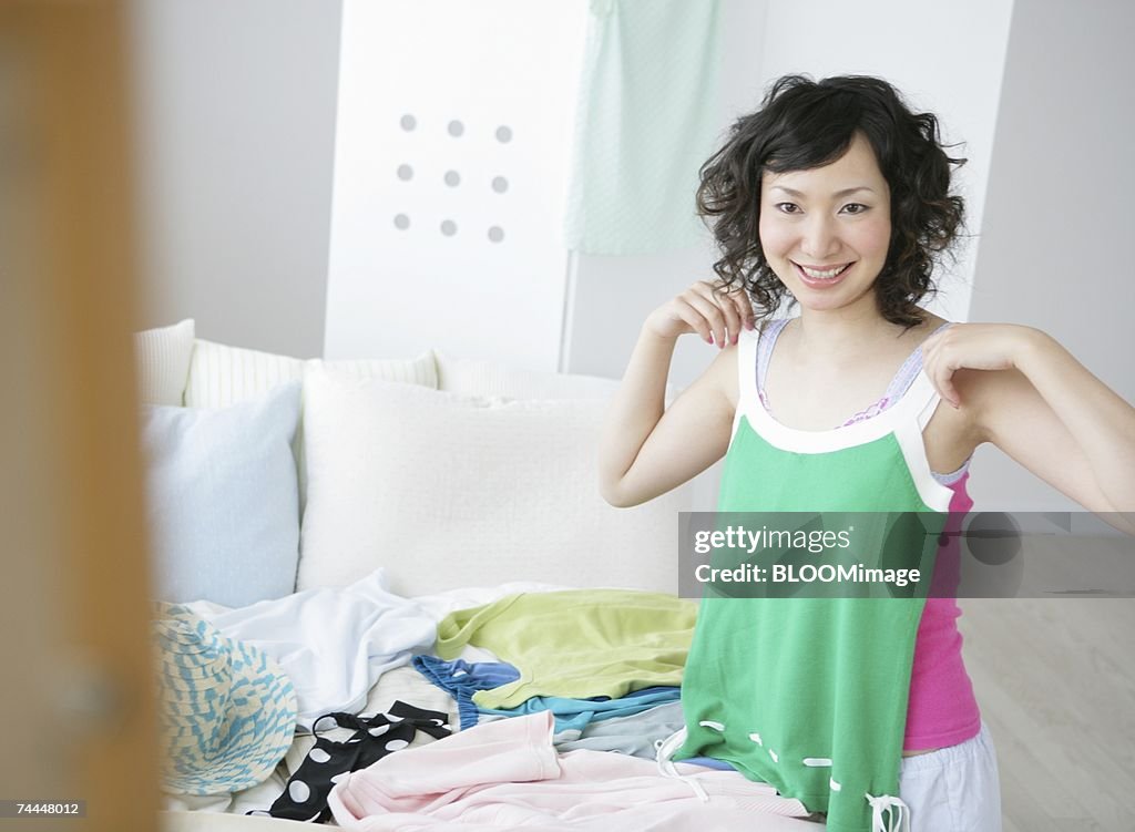 Japanese woman holding camisole