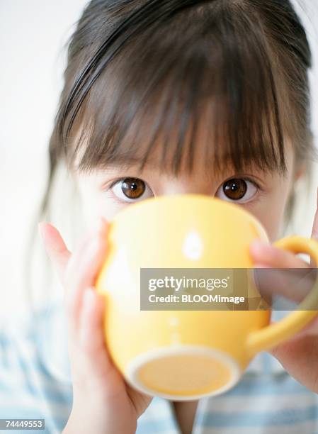 japanese girl dinking tea with looking at camera - japanese girls hot fotografías e imágenes de stock