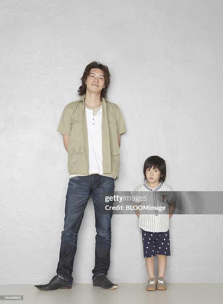 Japanese man and boy standing with smiling