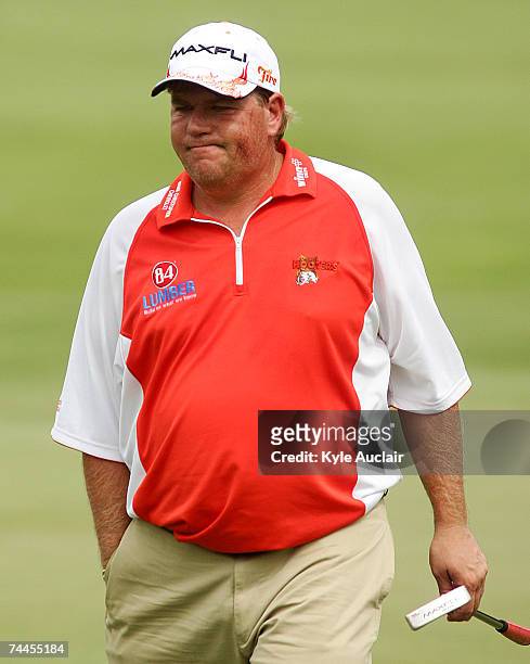 John Daly walks off the seventh green during the second round of the Stanford St. Jude Championship at the TPC Southwind on June 8, 2007 in Memphis,...