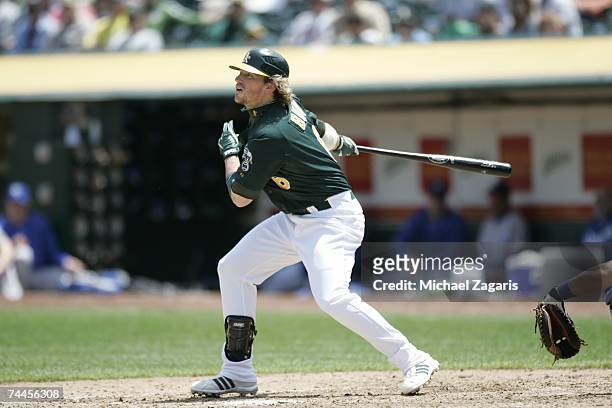 Travis Buck of the Oakland Athletics hits during the game against the Kansas City Royals at the McAfee Coliseum in Oakland, California on May 17,...
