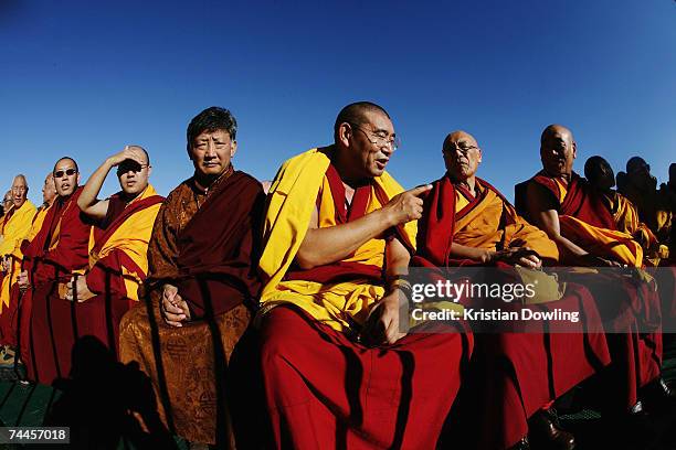 Buddhist Monk Geshe Sonam Thargye and fellow Buddhist monks look on during the Dalai Lama's free public talk about Universal Responsibility at MC...