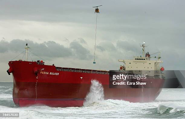 Helicopter drops supplies to the salvage crew on the coal ship the Pasha Bulker to assess the damage as it sits off Nobbys Beach June 9, 2007 in...