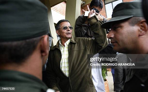 Revolutionary Armed Forces of Colombia rebel Rodrigo Granda waves to journalists after a press conference at the Roman Catholic archbishop's offices,...
