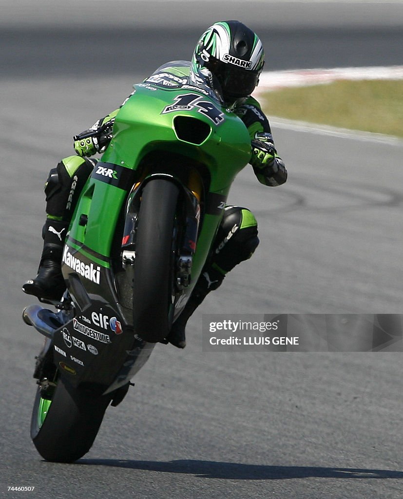 French Randy De Puniet (Kawasaki) drives...