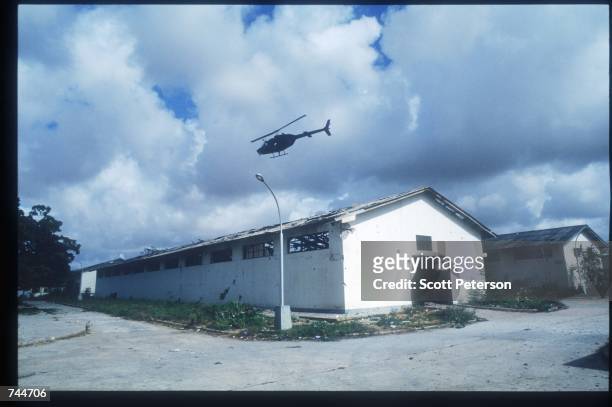 Blackhawk helicopter flies during the attack on warlord Aidid December 6, 1993 in Mogadishu, Somalia. US gunships attacked the compound of warlord...