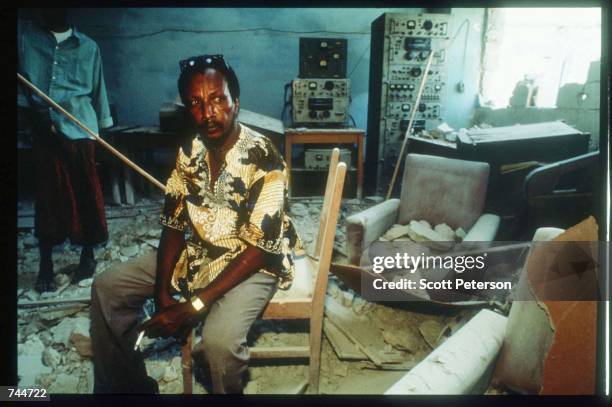Man sits among the wreckage in Radio Mogadishu after the US helicopter attack December 6, 1993 in Mogadishu, Somalia. US gunships attacked the...
