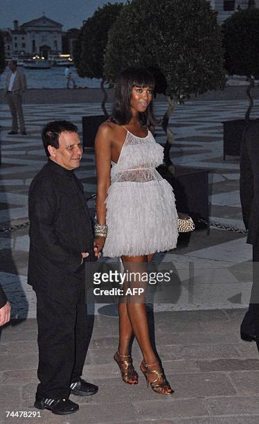 Tunisian fashion designer Azzedine Alaia and British top model Naomi Campbell pose as they arrives 08 June 2007 at Chief Executive Officer of PPR...