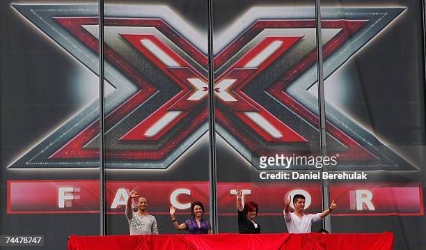 Judges for the new X Factor series 4, Brian Friedman, Dannii Minogue, Sharon Osbourne and Simon Cowell wave to the crowd during the first day of...