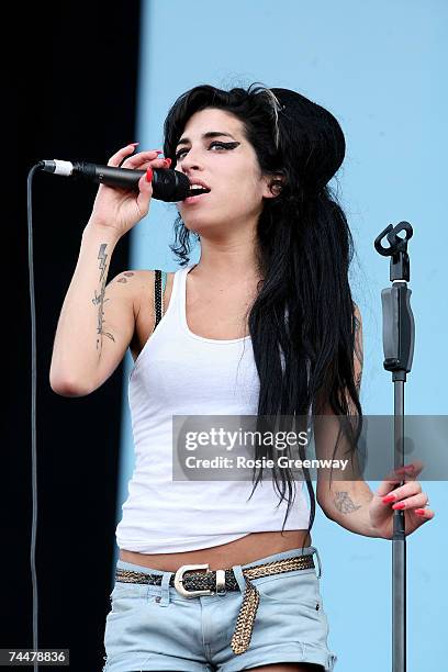 Amy Winehouse performs on stage on the second day of the Isle of Wight Festival 2007 in Newport on June 9, 2007 on the Isle of Wight, England.