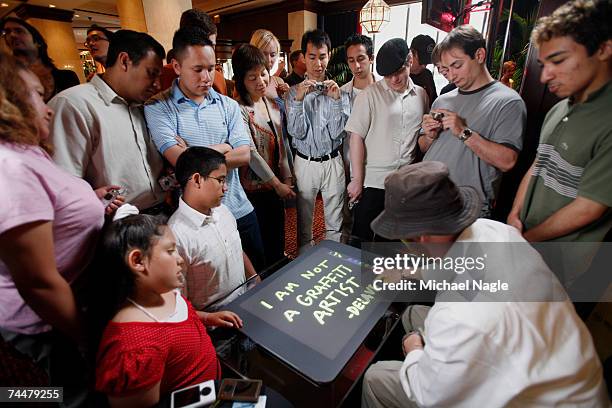 New York Street Artist James De La Vega demonstrates the painting feature of Microsoft Surface at the Sheraton New York Hotel & Towers June 9, 2007...