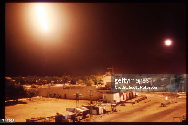 Unidentified lights illuminate the night sky June 20, 1993 in Mogadishu, Somalia. An estimated 350,000 Somalis died due to war, famine and disease...