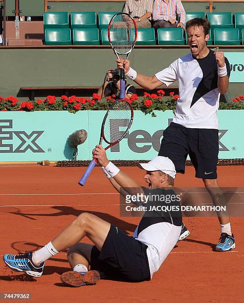 Bahamas Mark Knowles and Canadian Daniel Nestor react after beating Czech players Lukas Dlouhy and Pavel Vizner during their French Tennis Open men's...