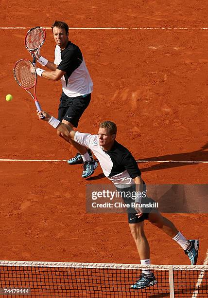 Daniel Nestor of Canada and Mark Knowles of the Bahamas in action against Lukas Dlouhy and Pavel Vizner of Czech Republic during the doubles final on...