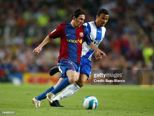 Leo Messi of Barcelona and Jonatas of Espanyol in action during the La Liga match between Barcelona and Espanyol at the Camp Nou stadium on June 9,...
