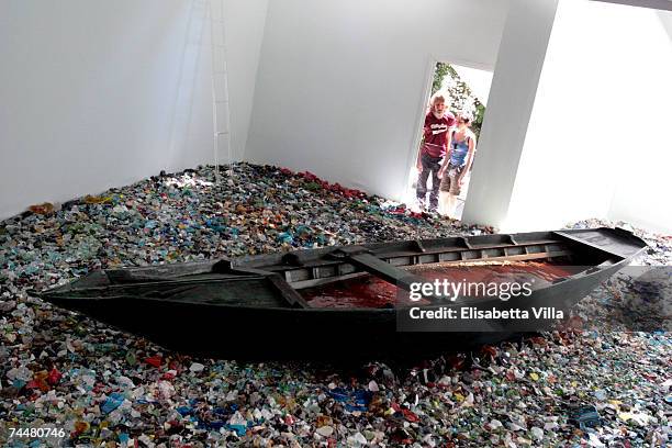 Visitors look at the installation "Landing prohibited" by Finnish artist Maaria Wirkkala at the Finnish pavilion designed by Alvar Aalto during the...