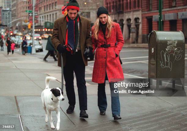 John F. Kennedy Jr. And his wife Carolyn walk with their dog January 1, 1997 in New York City. July 16, 2000 marks the one-year anniversary of the...