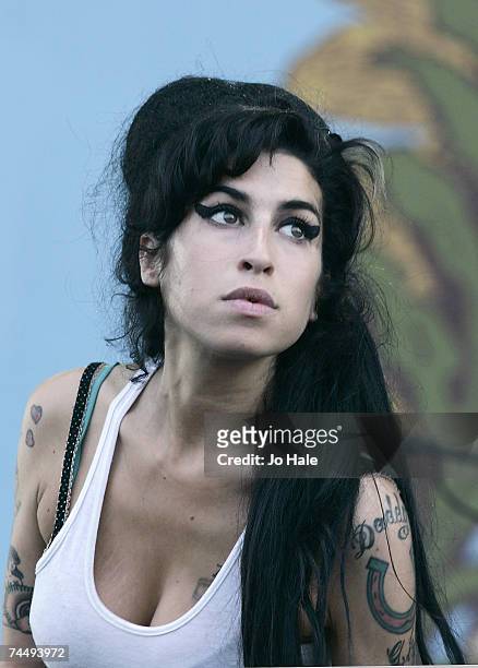 Musician Amy Winehouse performs on stage on the second day of the Isle of Wight Festival 2007 in Newport on June 9, 2007 on the Isle of Wight,...