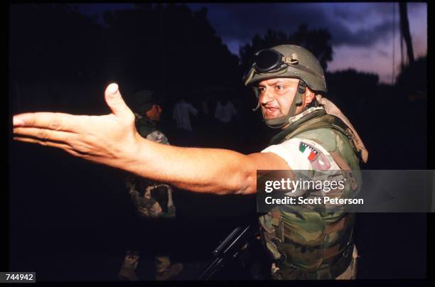 United Nations soldier reaches out his hand June 6, 1993 in Mogadishu, Somalia. UN troops seized the residence of General Mohammad Aidid, a warlord...